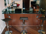 Custom Features: glass bar top with stainless steel standoffs